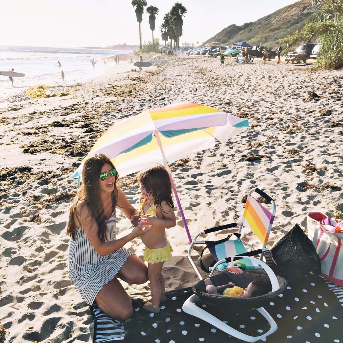 baby hanging out at the beach in a 4moms bounceroo!