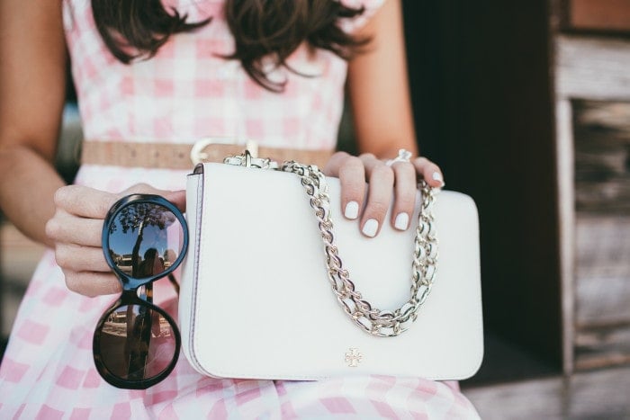 pretty spring accessories! love the white nails with the white bag. this one kind of looks like a chanel without the price tag of a chanel.