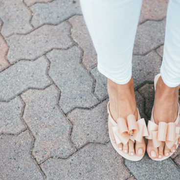 pink Melissa Sandals with pink top and white pants