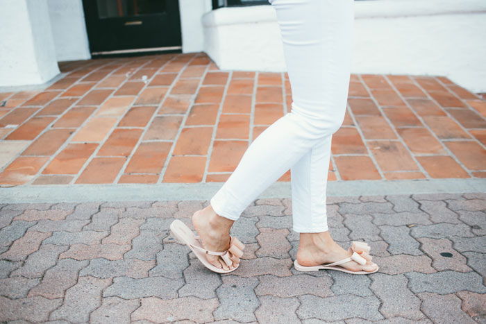 pink Melissa Sandals with pink top and white pants