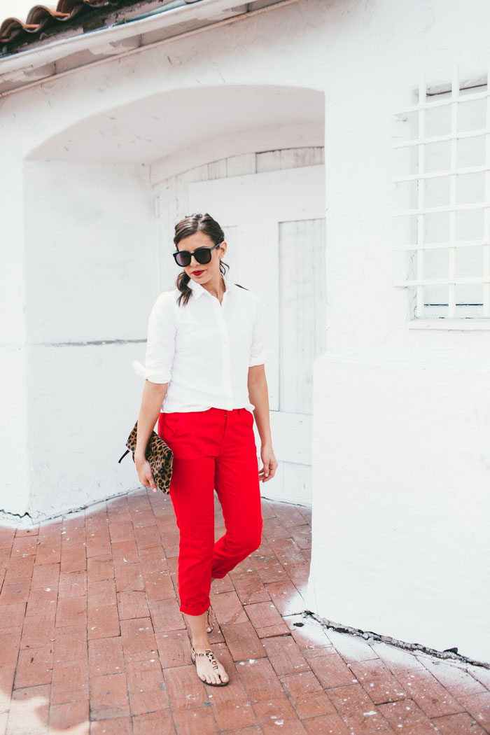 white top and bright red pants 