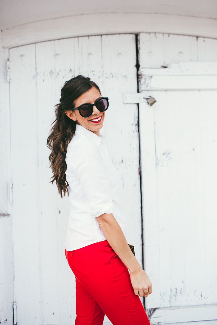 white top and bright red pants 
