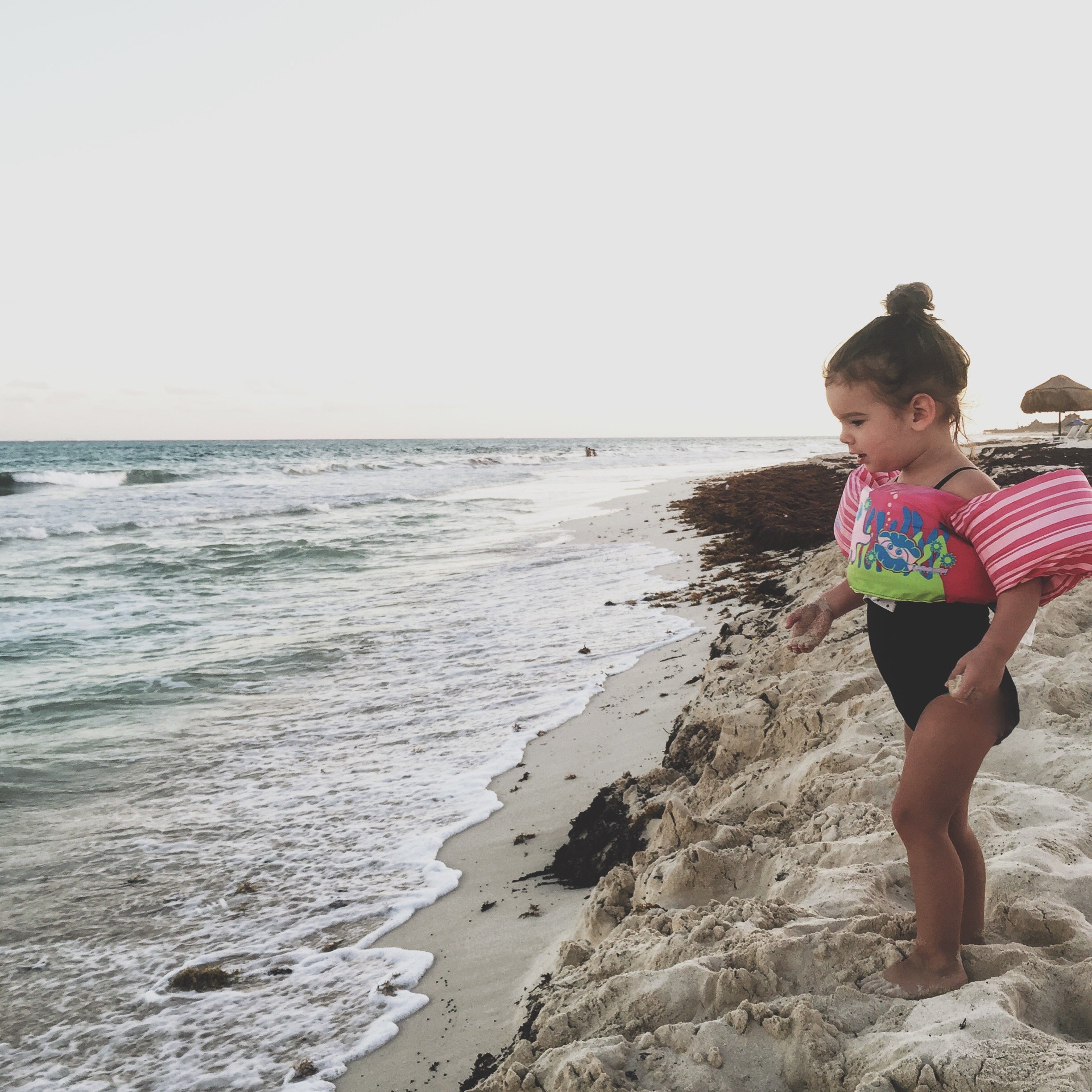 baby at the beach with puddle jumper