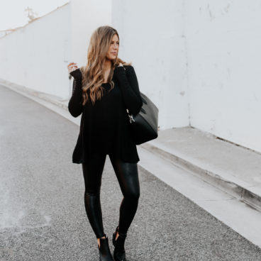 Corrine wearing all black outfit featuring SPANX faux leather leggings