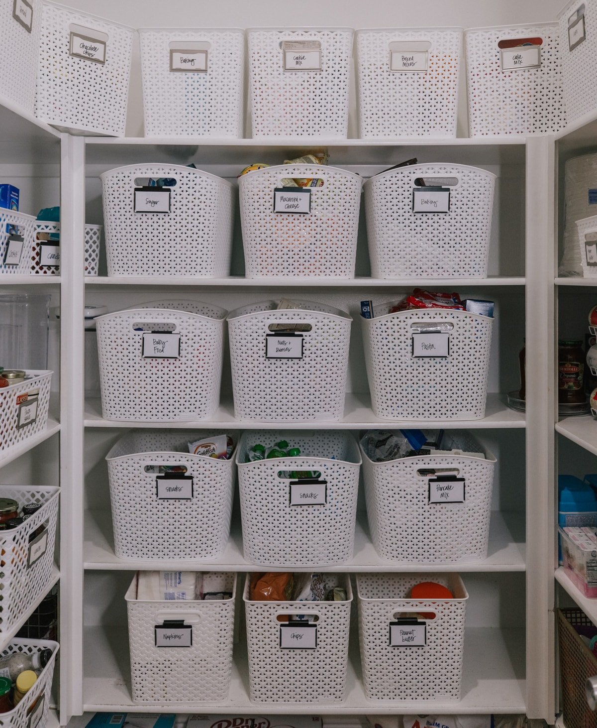 white baskets pantry organizing