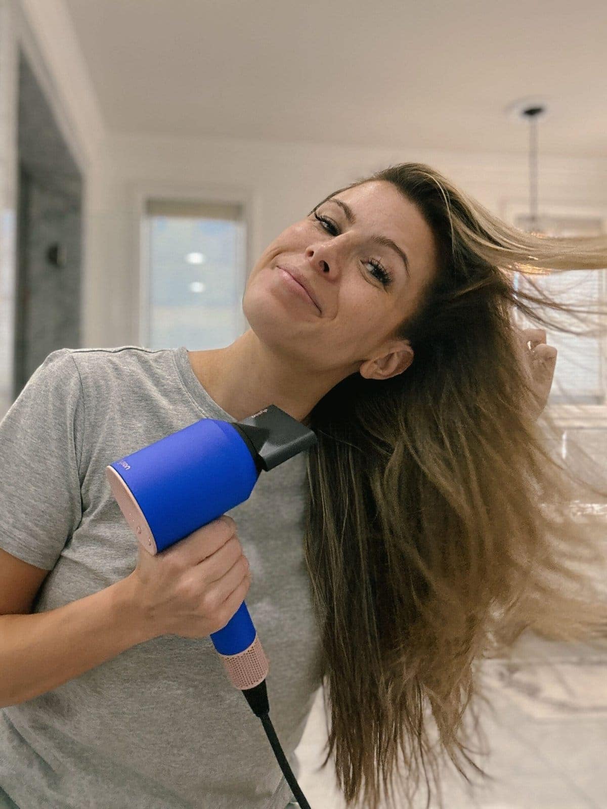 Corrine using Dyson Hair Dryer