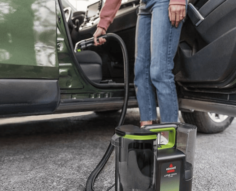 BISSELL® Little Green® Max Pet Portable Carpet and Upholstery Deep Cleaner used to clean car