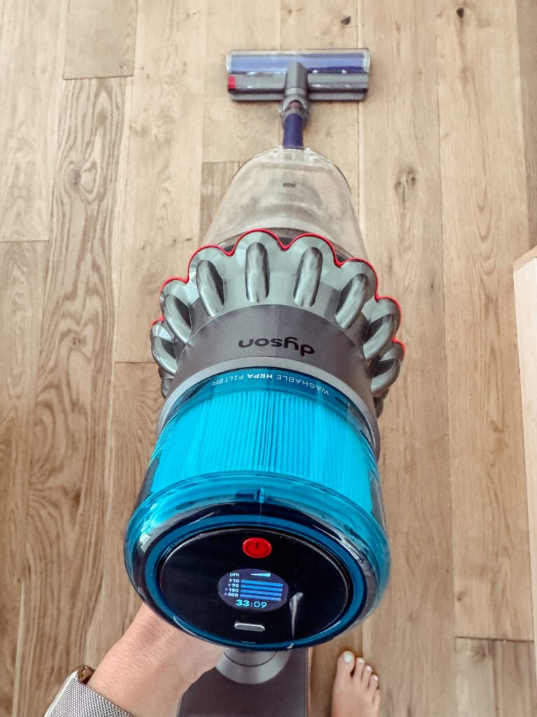 Corrine using Dyson Gen5 Detect Outsize vacuum