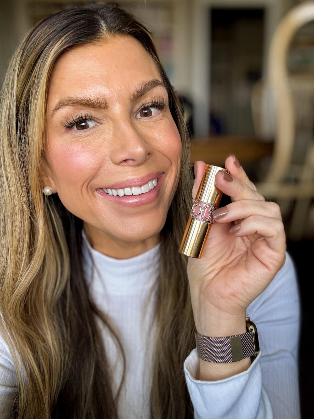 Corrine holding YSL lippie