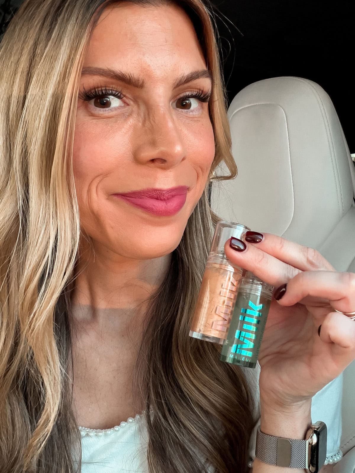 corrine holding the milk primer duo