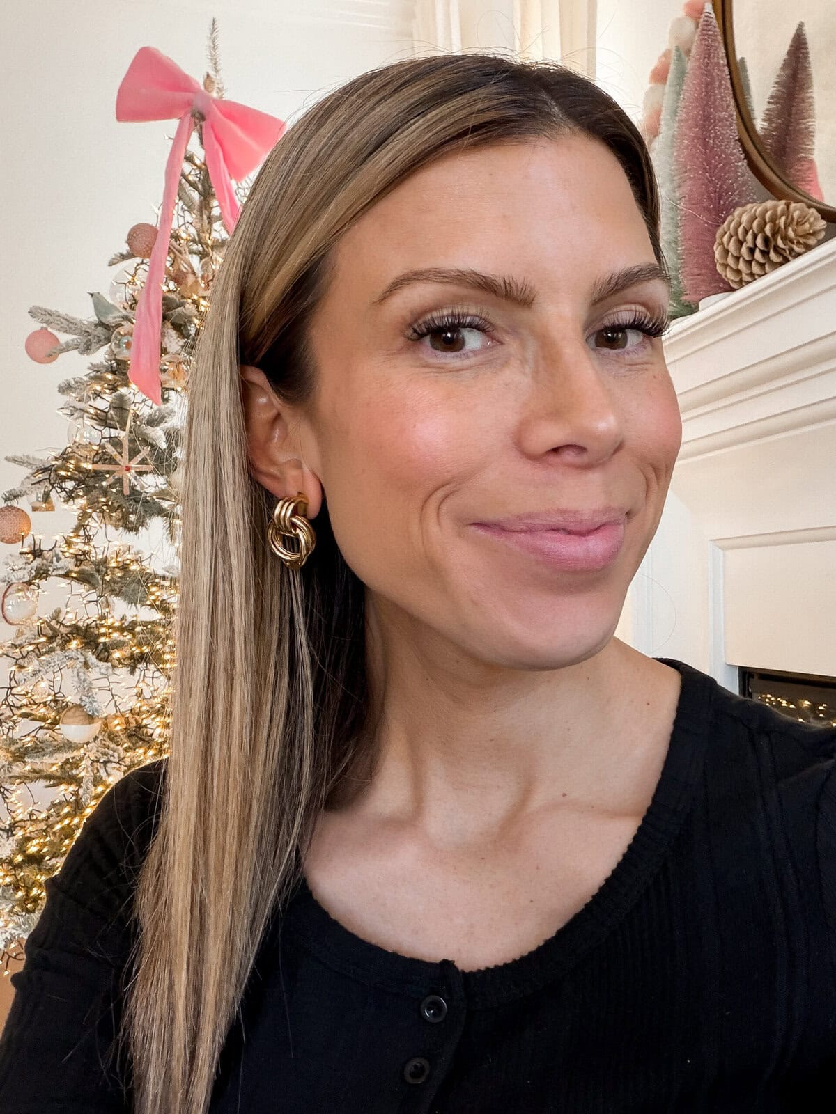 corrine wearing baublebar earrings