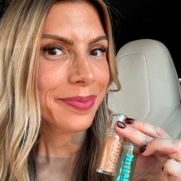 Corrine holding Milk Makeup Hydrogrip Primer duo