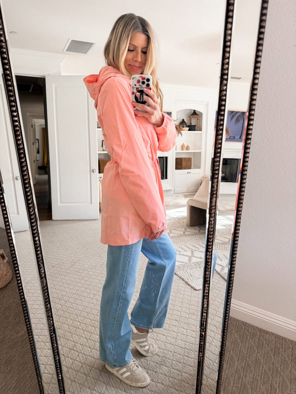 Corrine wearing pink raincoat