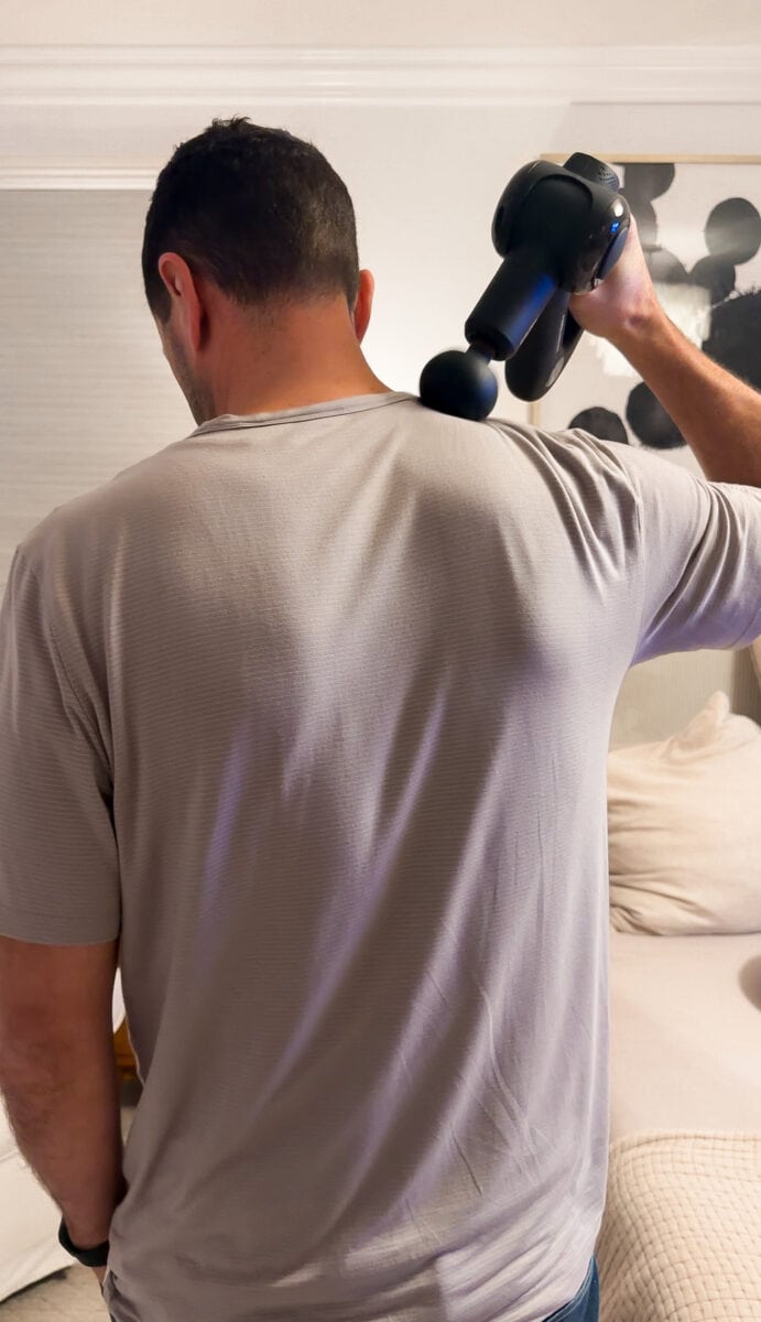 Neil using the massage gun
