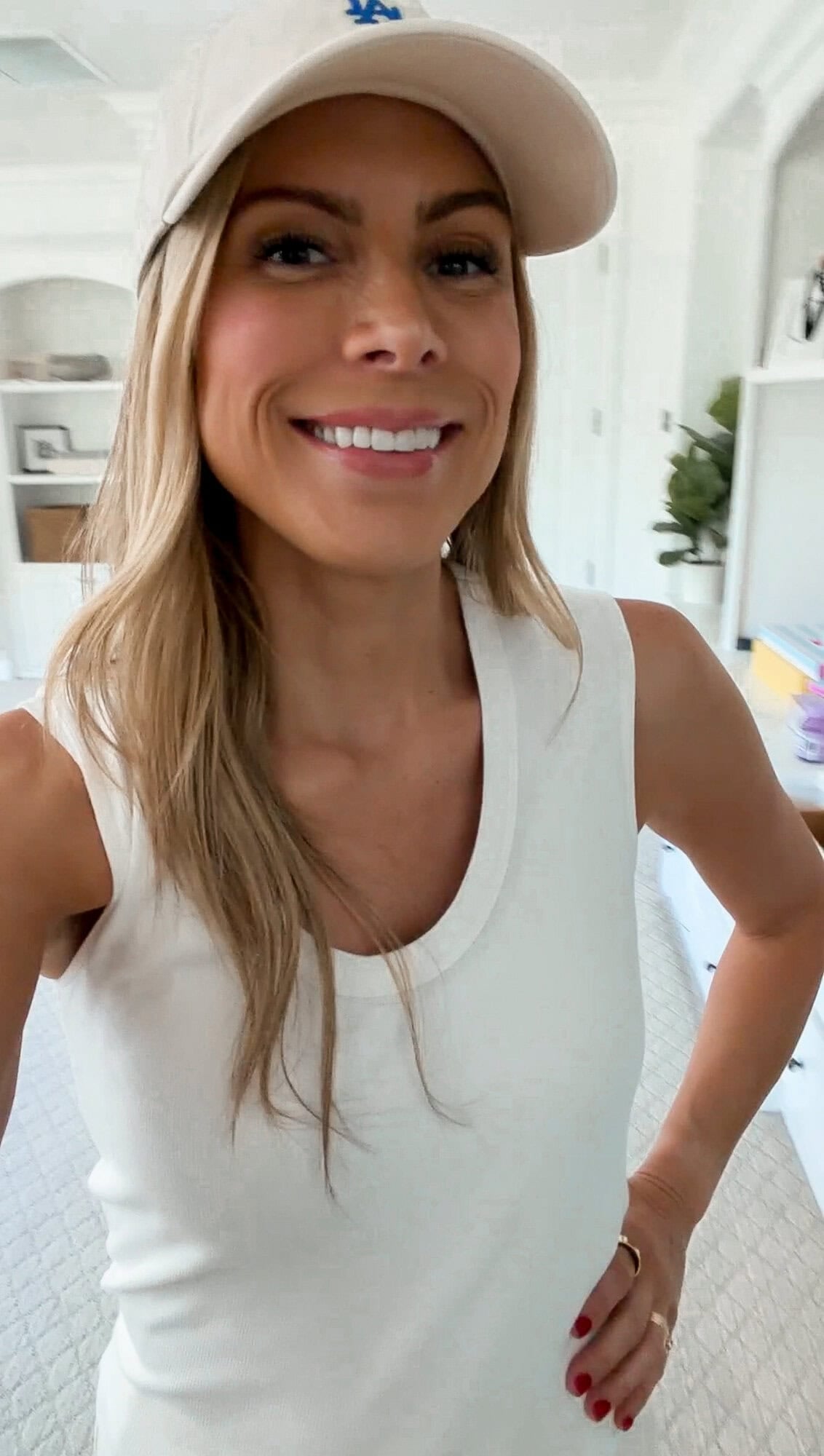 Corrine in white sleeveless scoop-neck tank top close-up