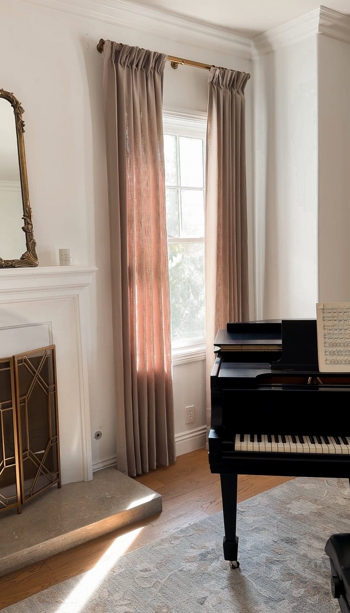 Pinch pleat linen curtains in the piano room