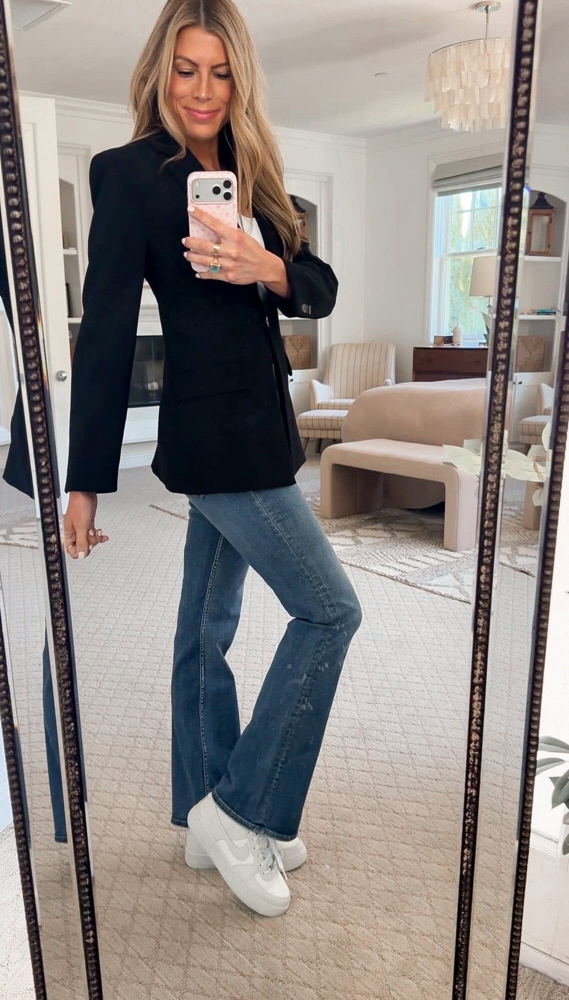 me wearing the blazer with bootcut jeans and Nike sneakers for a casual day
